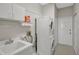 Convenient laundry room with washer, dryer, and utility sink at 2316 Harrier Way, Nokomis, FL 34275