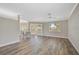 Spacious living area featuring hardwood floors and access to the kitchen at 2316 Harrier Way, Nokomis, FL 34275