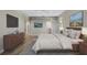 Spacious main bedroom with ample closet space and hardwood floors at 2316 Harrier Way, Nokomis, FL 34275
