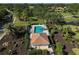 Community pool with surrounding landscaping and building at 2316 Harrier Way, Nokomis, FL 34275