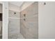 Large walk-in shower with tiled walls and a built-in seat at 2316 Harrier Way, Nokomis, FL 34275