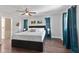 Stylish main bedroom with a king bed, modern decor, and hardwood floors at 2401 15Th W St, Palmetto, FL 34221