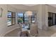 Breakfast nook with glass table and wicker chairs overlooking the pool at 25261 Spartina Dr, Venice, FL 34293