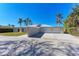 Contemporary home with two-car garage and spacious front yard at 320 S Shore Dr, Sarasota, FL 34234