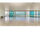 Open living space with water views and sliding glass doors at 320 S Shore Dr, Sarasota, FL 34234
