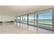 Bright living room with water views and sliding glass doors at 320 S Shore Dr, Sarasota, FL 34234