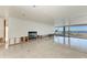 Living room with fireplace and access to waterfront views at 320 S Shore Dr, Sarasota, FL 34234
