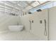 Luxurious outdoor bathroom with dual shower heads and a freestanding tub at 320 S Shore Dr, Sarasota, FL 34234