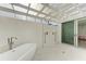 Spacious outdoor shower with a soaking tub, perfect for relaxing after a swim at 320 S Shore Dr, Sarasota, FL 34234