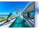 Relaxing lap pool with waterfront views and tropical landscaping at 320 S Shore Dr, Sarasota, FL 34234