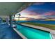 Expansive infinity-edge pool with waterfront views at 320 S Shore Dr, Sarasota, FL 34234