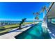 Long, refreshing pool with dolphin statue and waterfront view at 320 S Shore Dr, Sarasota, FL 34234