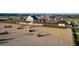 Aerial view of equestrian center with large sand arena and stables at 32206 Grand National Drive, Myakka City, FL 34251