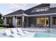 Luxury home with inviting pool, patio, and covered outdoor kitchen at 32206 Grand National Drive, Myakka City, FL 34251
