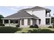 Two-story home with a large backyard and pool at 32206 Grand National Drive, Myakka City, FL 34251