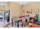 Cozy dining area with wooden table, neutral decor, and hardwood floors at 3426 72Nd E Dr, Sarasota, FL 34243