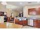 Kitchen featuring stainless steel dishwasher, sink and granite countertops, open to dining and living areas at 3426 72Nd E Dr, Sarasota, FL 34243