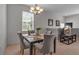 Dining area with a square table and four gray chairs at 3671 Parkridge Cir # 8-201, Sarasota, FL 34243