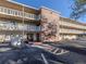 Sunland Gardens condo building exterior, featuring brick accents and balconies at 3755 S School Ave # 54, Sarasota, FL 34239