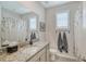 Clean bathroom with granite countertop, single sink, and shower at 419 157Th E Ct, Bradenton, FL 34212