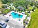 Aerial view of community resort-style pool with surrounding lounge chairs at 4239 Cottage Hill Ave, Parrish, FL 34219