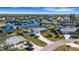 Wide aerial showcasing the home's waterfront location and neighborhood at 4406 Wynkoop Cir, Port Charlotte, FL 33948