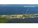Aerial view of coastal community with beach access and waterfront property at 4540 Gulf Of Mexico Dr # 304, Longboat Key, FL 34228