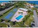 Aerial view showing tennis courts, pool, and clubhouse at 4540 Gulf Of Mexico Dr # 304, Longboat Key, FL 34228