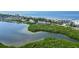 Aerial view showcasing waterfront property near the beach at 4540 Gulf Of Mexico Dr # 304, Longboat Key, FL 34228