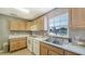 Simple yet functional community kitchen with ample counter space at 4540 Gulf Of Mexico Dr # 304, Longboat Key, FL 34228