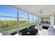 Enclosed balcony boasting scenic waterfront views at 4540 Gulf Of Mexico Dr # 304, Longboat Key, FL 34228