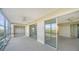 Spacious enclosed balcony with sliding doors leading to bedrooms and a view at 4540 Gulf Of Mexico Dr # 304, Longboat Key, FL 34228
