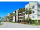 Condo building exterior showcasing its architecture and landscaping at 4540 Gulf Of Mexico Dr # 304, Longboat Key, FL 34228