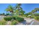 Landscaped grounds with lush tropical plants and walkway at 4540 Gulf Of Mexico Dr # 304, Longboat Key, FL 34228