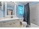Bathroom with light blue walls, tub and vanity at 4905 22Nd E Ct, Bradenton, FL 34203