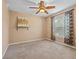 Bright bedroom with ceiling fan and large window at 4905 22Nd E Ct, Bradenton, FL 34203