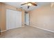 Bedroom with double door closet and ceiling fan at 4905 22Nd E Ct, Bradenton, FL 34203