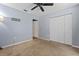 Bedroom with double door closet and ceiling fan at 4905 22Nd E Ct, Bradenton, FL 34203
