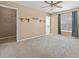 Spacious bedroom with ceiling fan, large closet, and carpet at 4905 22Nd E Ct, Bradenton, FL 34203