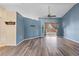 Living room with hardwood flooring, high ceilings, and access to a back patio at 4905 22Nd E Ct, Bradenton, FL 34203