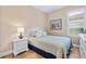 Comfortable bedroom with full bed and nightstand at 4937 Savona Run, Bradenton, FL 34211