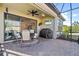 Relaxing covered patio with seating area and grill at 4937 Savona Run, Bradenton, FL 34211