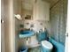 Retro bathroom with blue vanity and shower/tub combo at 5443 Avenida Del Mare, Sarasota, FL 34242