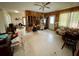 Living room with wood paneling and a ceiling fan at 5443 Avenida Del Mare, Sarasota, FL 34242