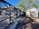 Side yard view showing pool, shed, and walkway at 5443 Avenida Del Mare, Sarasota, FL 34242