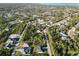 Aerial view showcasing a house and its neighborhood near a body of water at 5533 Gulfport Ter, Port Charlotte, FL 33981