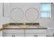 Bathroom featuring double sinks, granite countertops, and modern fixtures at 5548 Summit Gln, Bradenton, FL 34203