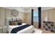 Stylized bedroom with a large bed, an oversized clock on the wall, and bright accents at 5548 Summit Gln, Bradenton, FL 34203