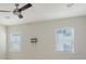 Upstairs bonus room with two windows, a ceiling fan, and television mount at 5548 Summit Gln, Bradenton, FL 34203