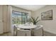 Bright dining area features a round table and sliding glass doors to the outdoor play area at 5548 Summit Gln, Bradenton, FL 34203